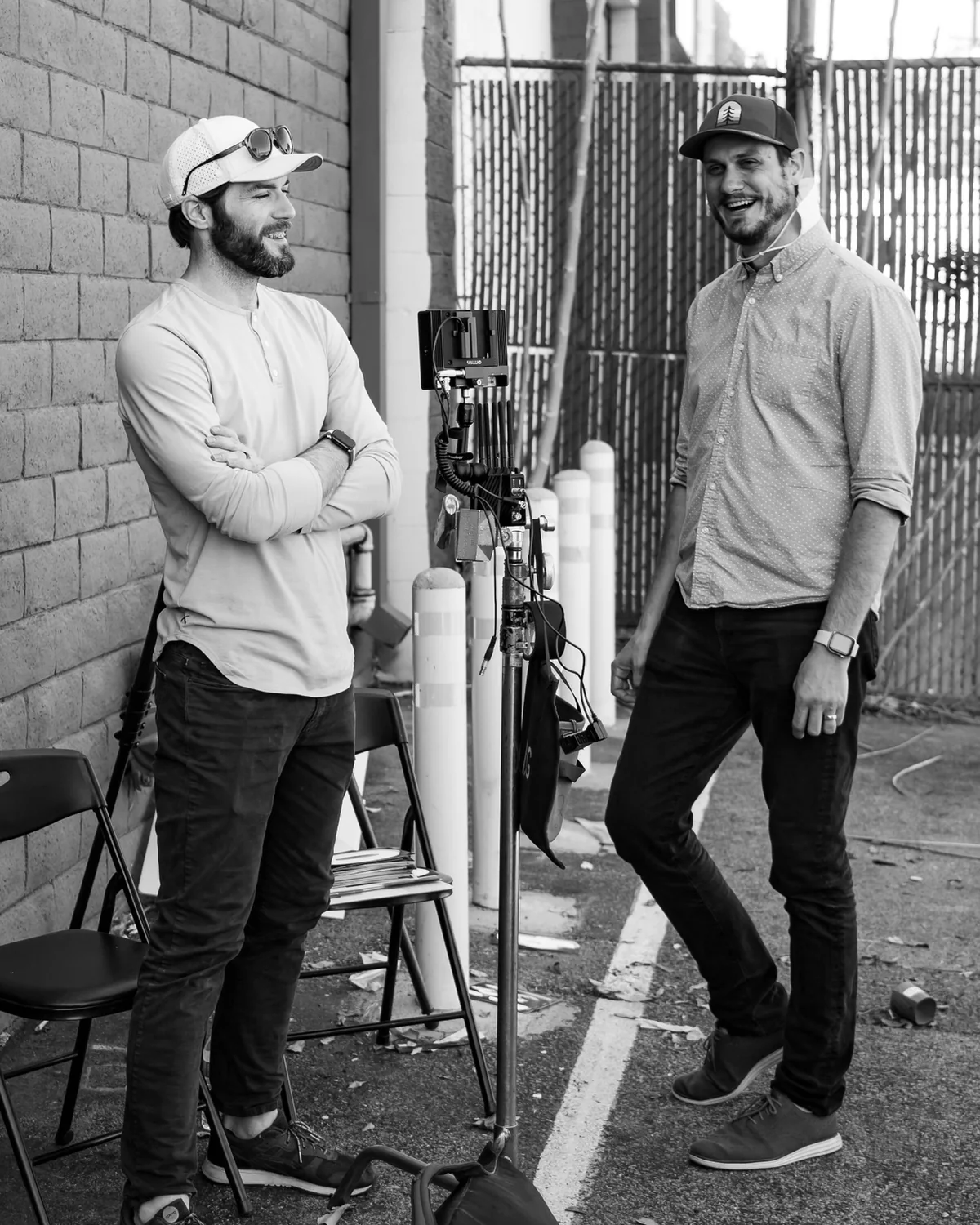 A candid moment beside the camera between takes.