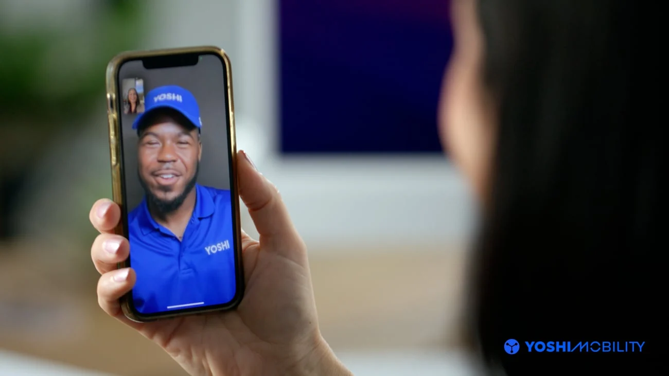 A Yoshi team member speaking with a customer by video call.
